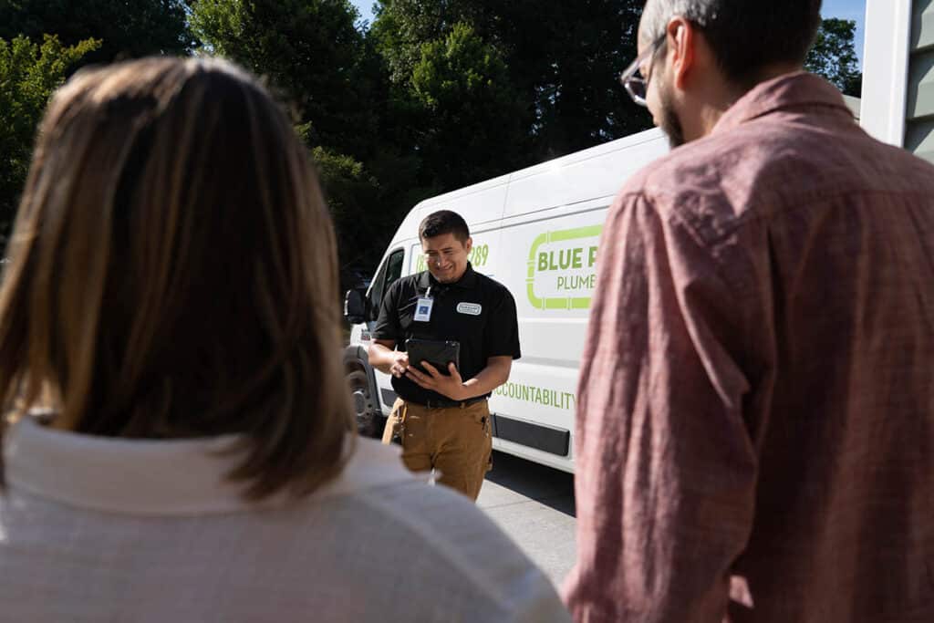 Pablo from Blue Planet Plumbing, talks with customers