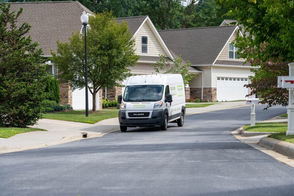 Blue Planet Plumbing truck in neighborhood